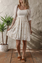 Load image into Gallery viewer, Beige Embroidered Flower Smocked Bust Half Puff Sleeve Empire Waist Textured Flowy Dress | Arrow Boutique | | Arrow Women&#39;s Boutique