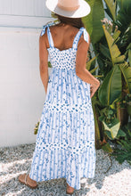 Load image into Gallery viewer, Sky Blue Floral Smocked Tied Straps A-Lined Tiered Maxi Dress | Arrow Boutique | | Arrow Women&#39;s Boutique